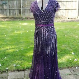 Stunning formal gown.  Purple w/sequence. Fitted